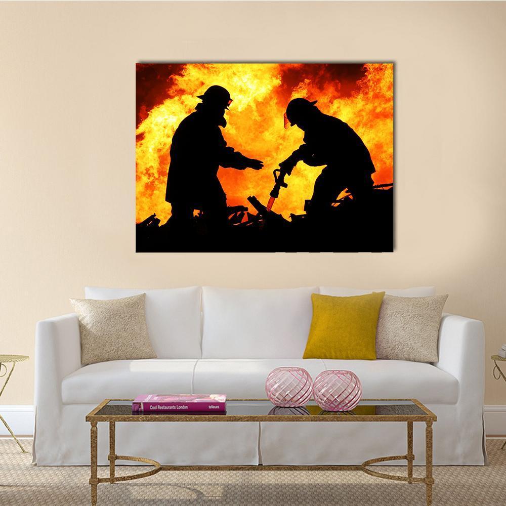 Firefighters Silhouetted Against Flames Canvas Wall Art in black, orange and yellow, single panel hung on a wall