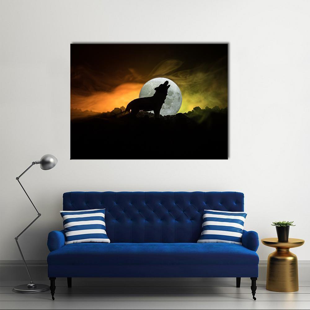 Howling Wolf Silhouette Under Full Moon Canvas Wall Art in black, orange and yellow, single panel hung on a wall