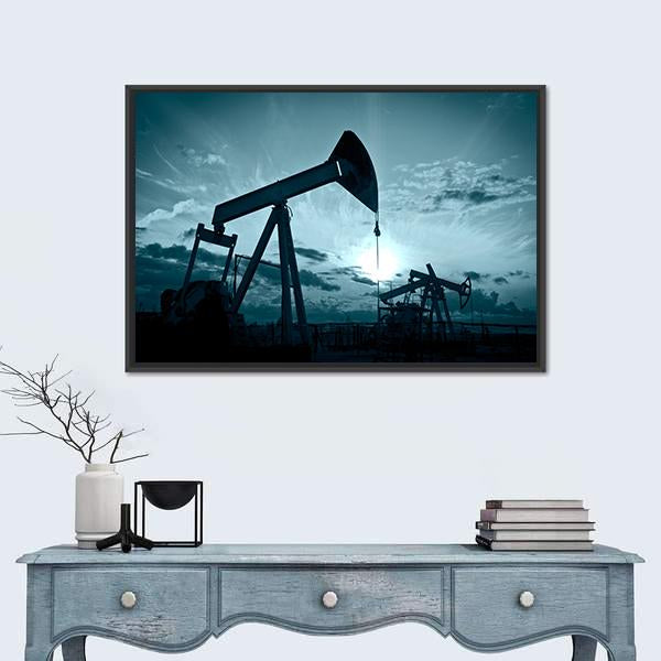 Silhouetted Oil Pumps at Sunset Canvas Wall Art in black and blue, framed canvas, product view on a white background