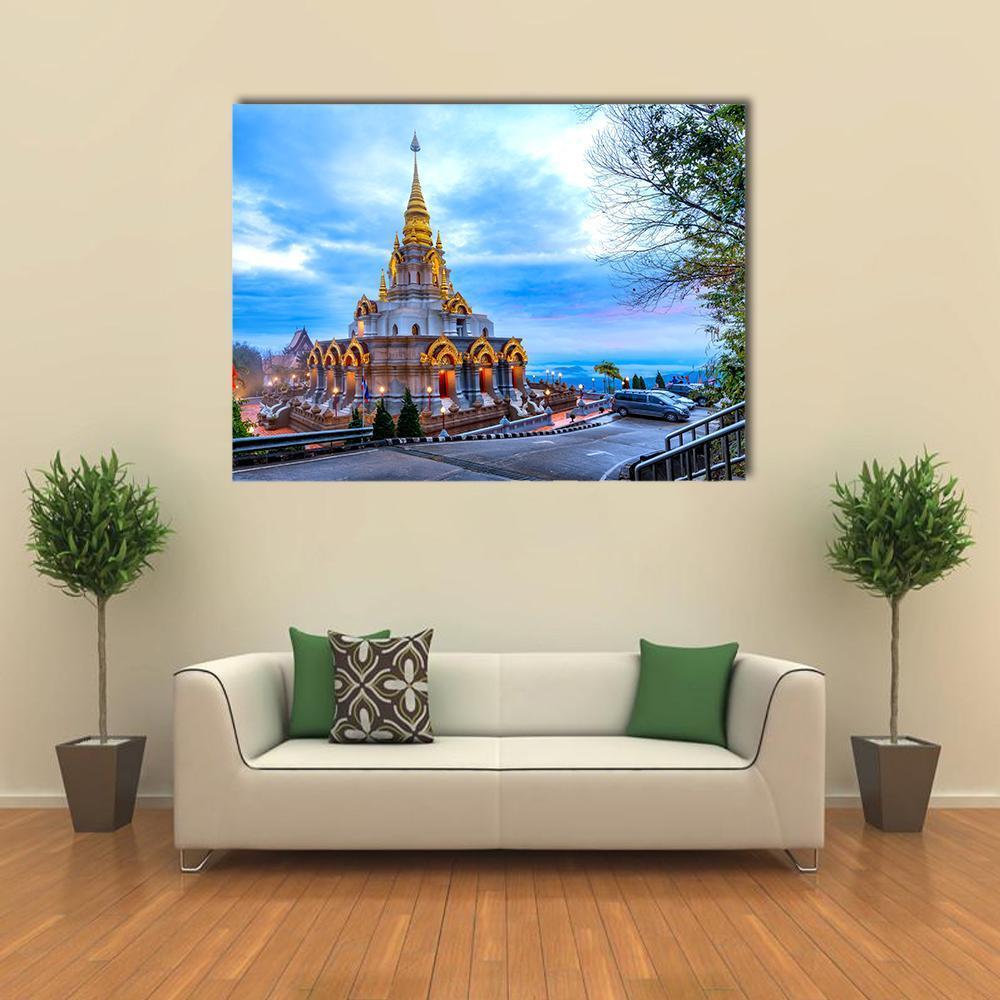 Sinakarintra Stit Mahasantikhiri Pagoda Canvas Wall Art in gray, gold and blue, single panel hung on a wall