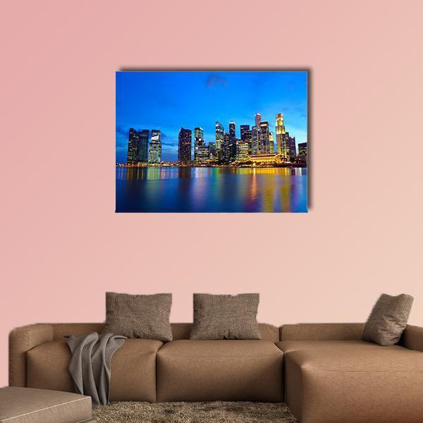 Singapore City at Night Canvas Wall Art in black, yellow and blue, single panel hung on a wall