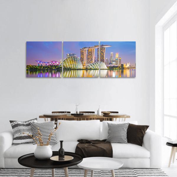 Singapore Twilight Skyline Panoramic Canvas Wall Art in gold, blue and purple, hung on a wall