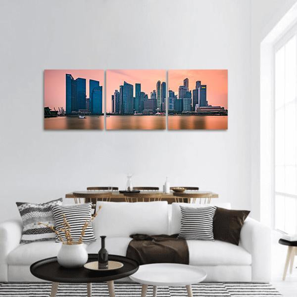 Singapore Marina Bay Skyline Panoramic Canvas Wall Art in orange, blue and pink, hung on a wall