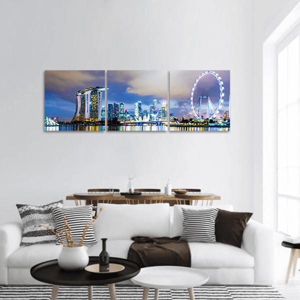 Night View of Singapore Skyline Panoramic Canvas Wall Art in black, blue and purple, hung on a wall