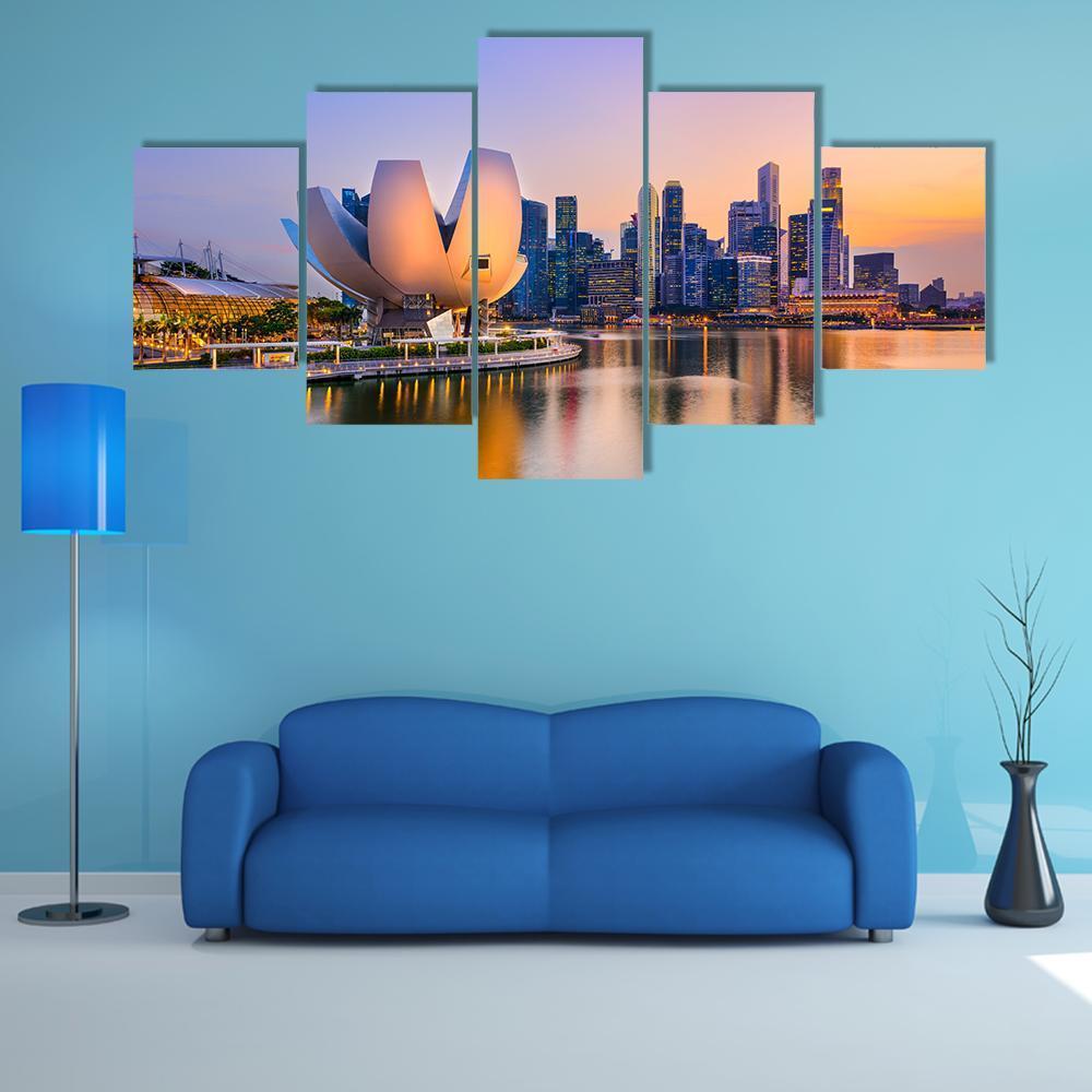 Marina Bay Sands Skyline at Twilight Canvas Wall Art in orange, blue and purple, 5 panel Star layout hung on a wall