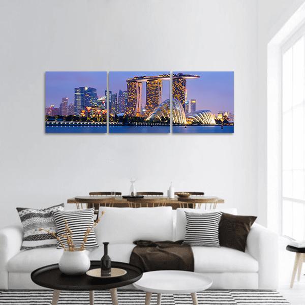 Singapore Skyline with Marina Bay Sands Panoramic Canvas Wall Art in gold, blue and purple, hung on a wall