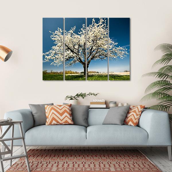 Single Blossoming Tree in Spring Canvas Wall Art in white, green and blue, single panel hung on a wall