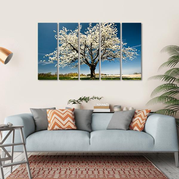 Single Blossoming Tree in Spring Canvas Wall Art in white, green and blue, single panel hung on a wall
