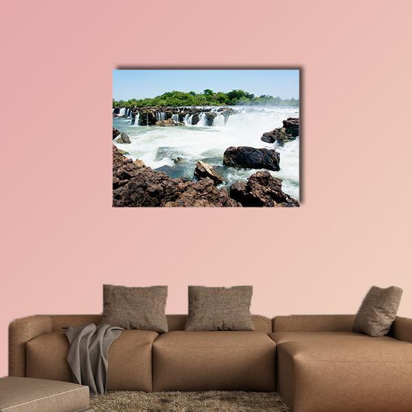 Sioma Falls on the Zambezi River Canvas Wall Art in white, brown and blue, single panel hung on a wall
