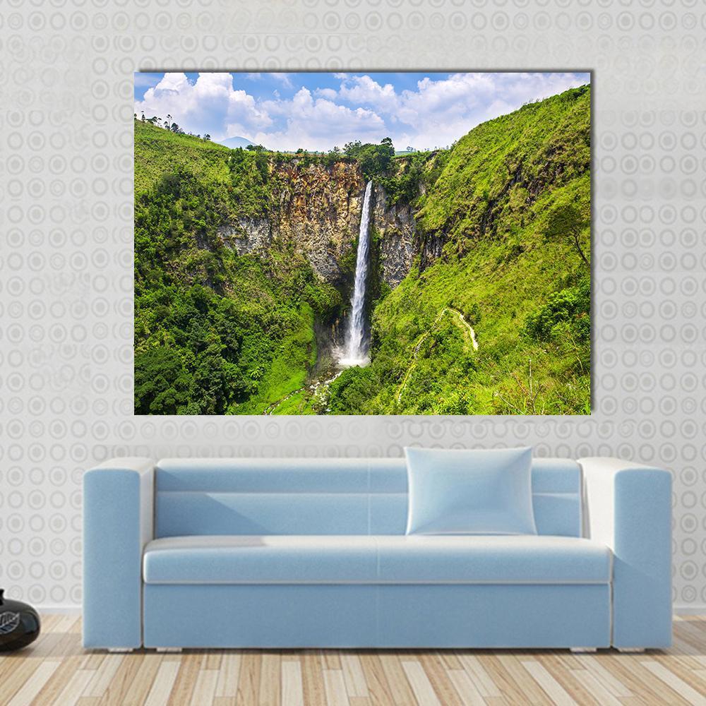 Sipisopiso Waterfall in Northern Sumatra Canvas Wall Art in brown, green and blue, single panel hung on a wall