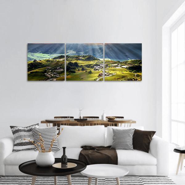 Sixty Stone Mountain Landscape Panoramic Canvas Wall Art in yellow, green and blue, hung on a wall