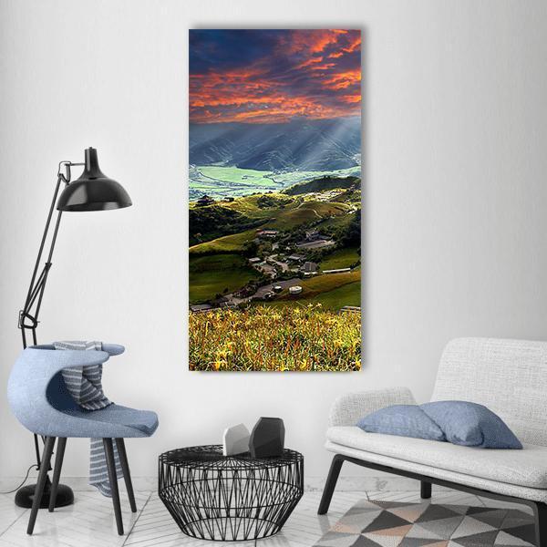 Sixty Stone Mountain at Sunset Vertical Canvas Wall Art in orange, green and blue, single vertical panel hung on a wall