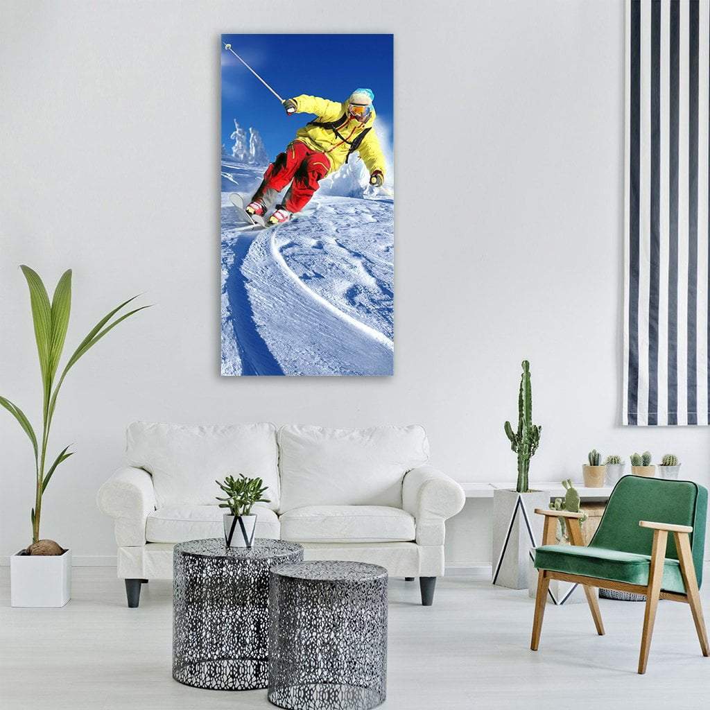Downhill Skier in Yellow Jacket Vertical Canvas Wall Art in white, yellow and blue, single vertical panel hung on a wall