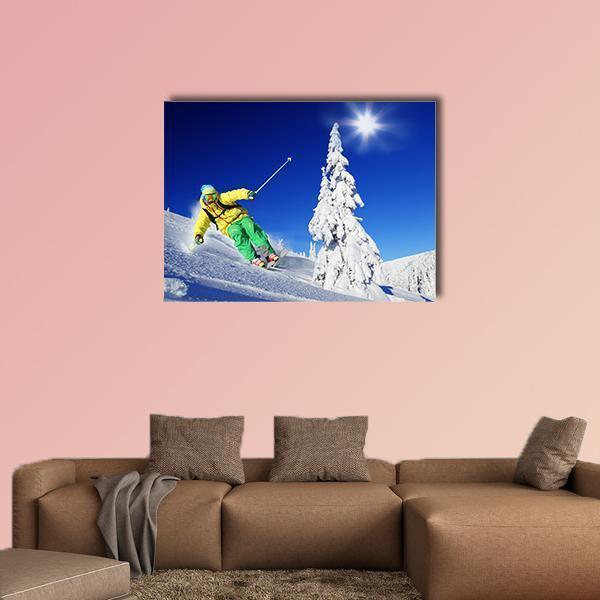 Skier Mid-turn in Sunlit Mountains Canvas Wall Art in white and blue, single panel hung on a wall