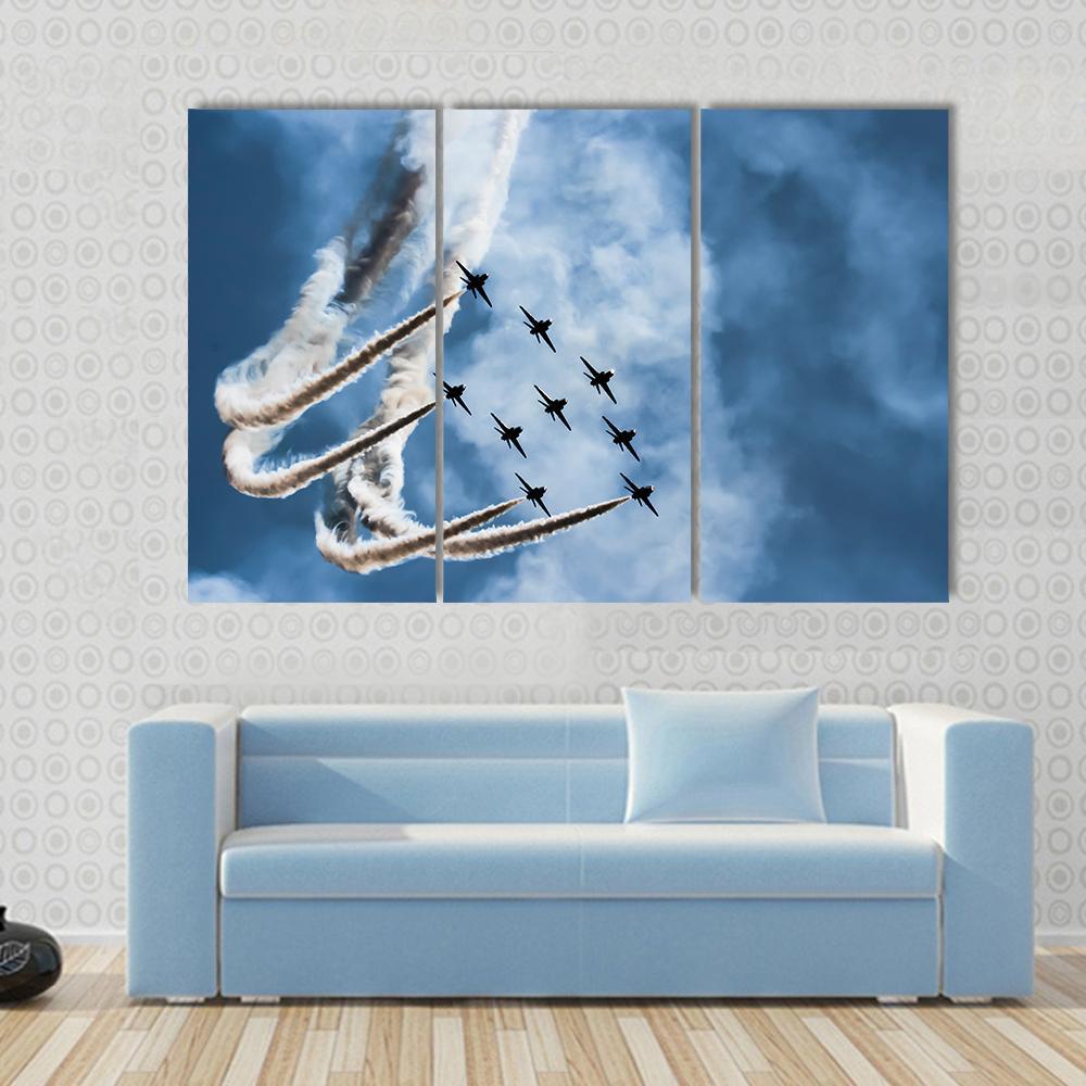 Sky Fighters Airshow Canvas Wall Art in white, gray and blue, hung on a wall