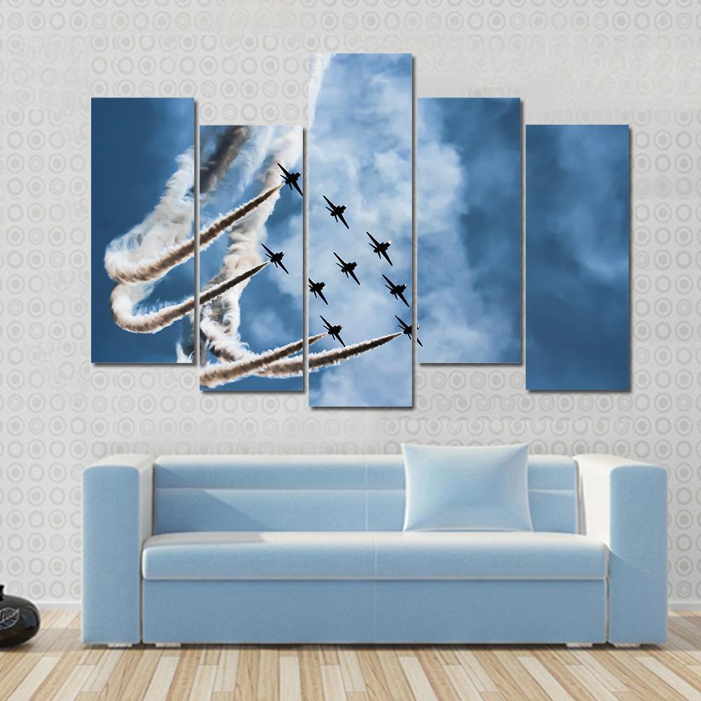 Sky Fighters Airshow Canvas Wall Art in white, gray and blue, hung on a wall
