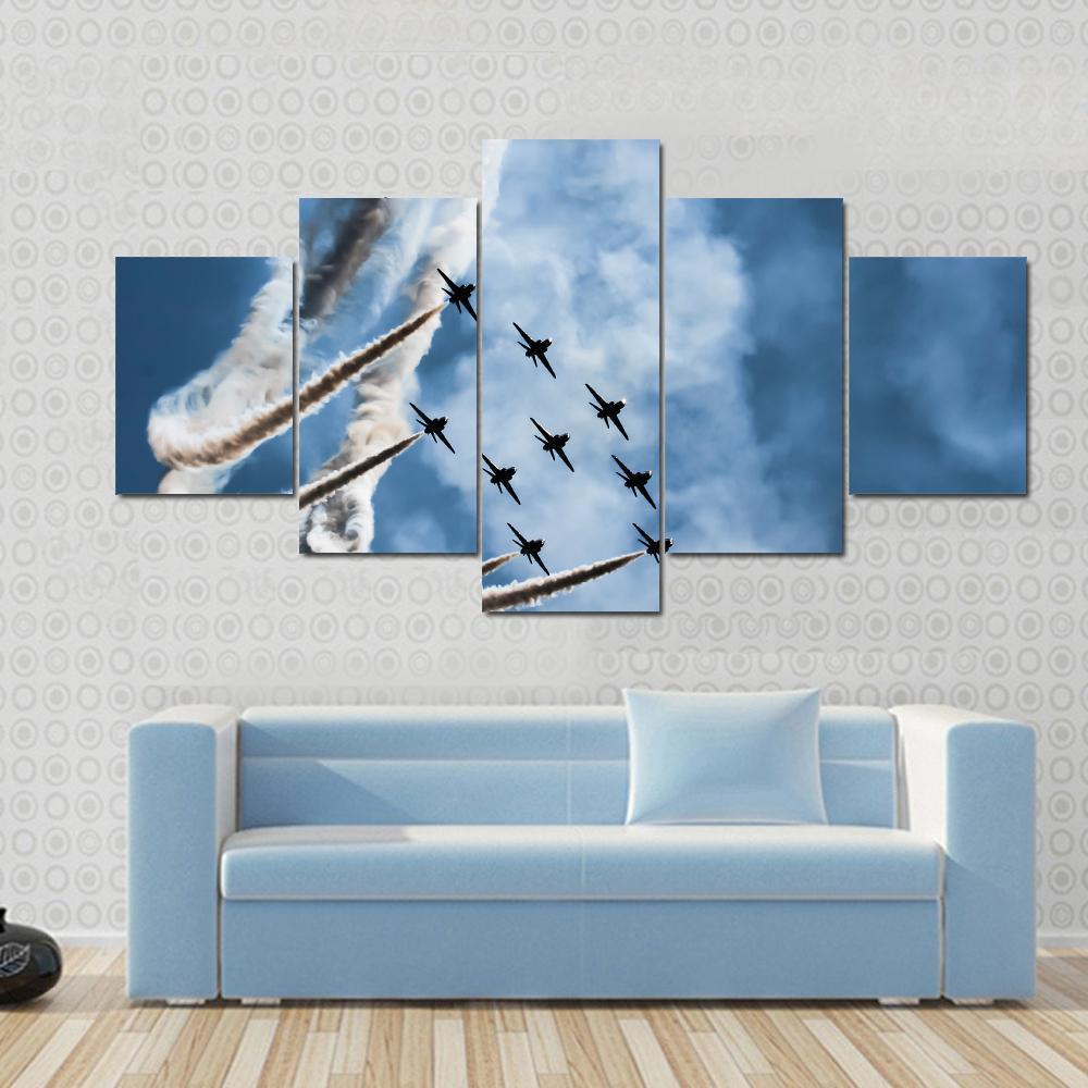 Sky Fighters Airshow Canvas Wall Art in white, gray and blue, hung on a wall