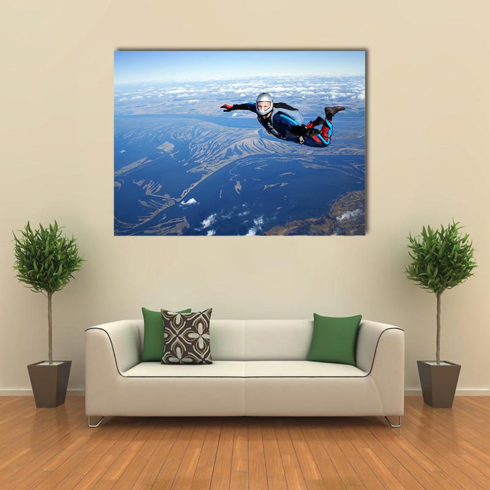 Skydiver Over River Delta Canvas Wall Art in white, brown and blue, single panel hung on a wall