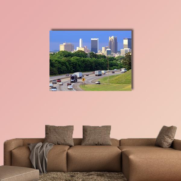 City Skyline with Highway Traffic Canvas Wall Art in gray, green and blue, single panel hung on a wall
