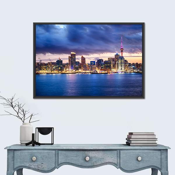 Skyline of Auckland New Zealand Canvas Wall Art in yellow, blue and purple, framed canvas, product view on a white background