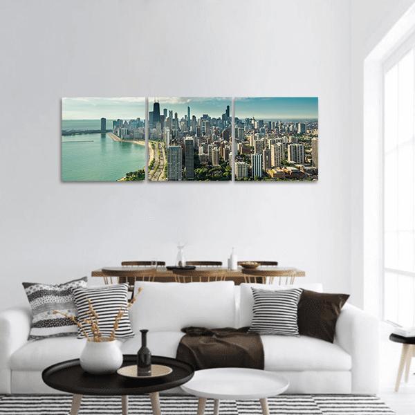 Chicago Skyline Over Lake Michigan Panoramic Canvas Wall Art in gray, green and blue, hung on a wall