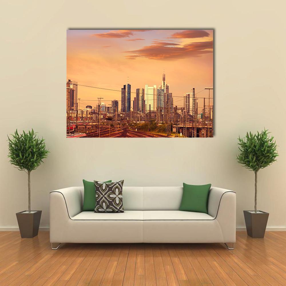 Frankfurt Skyline at Sunset Canvas Wall Art in gray, orange and yellow, single panel hung on a wall