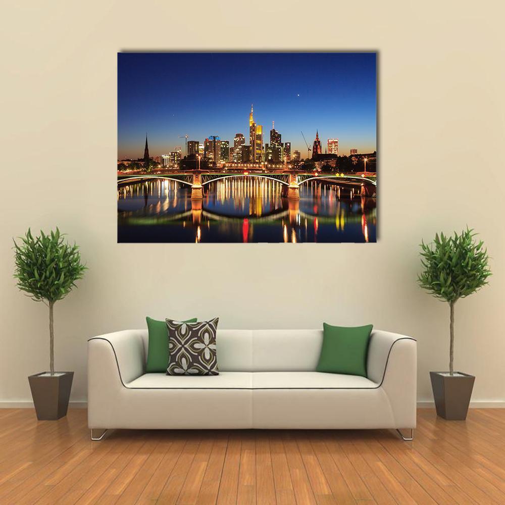 Frankfurt Skyline Over the Main River Canvas Wall Art in black, gold and blue, single panel hung on a wall