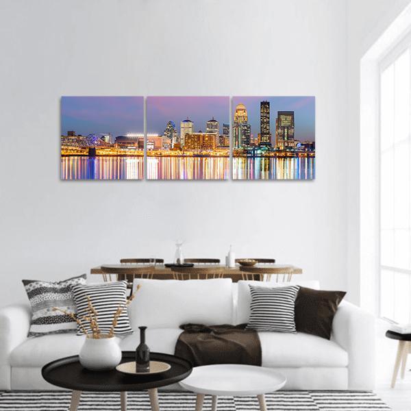 Louisville Skyline at Dusk Panoramic Canvas Wall Art in gold, blue and purple, hung on a wall