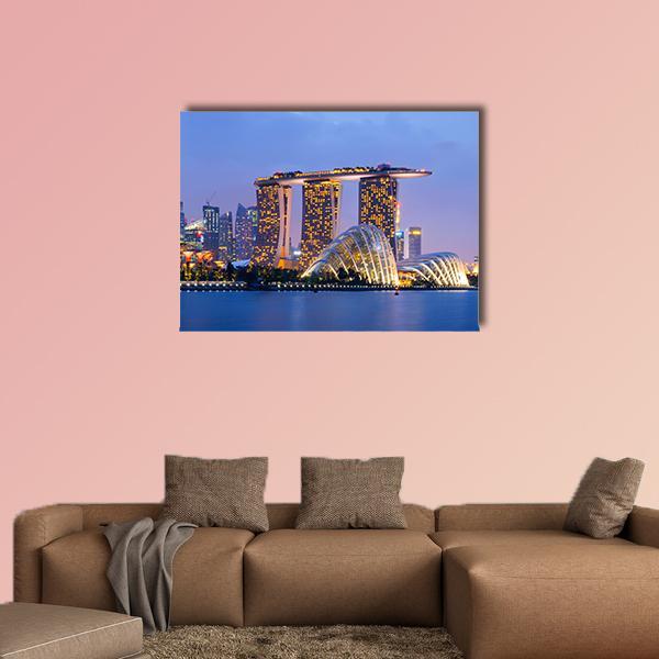 Singapore Skyline at Dusk Canvas Wall Art in orange, yellow and blue, single panel hung on a wall