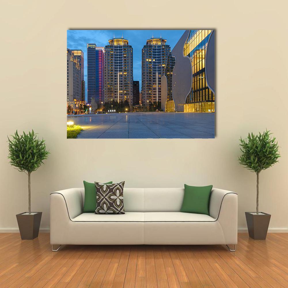 Taichung City Skyline at Dusk Canvas Wall Art in gray, yellow and blue, single panel hung on a wall