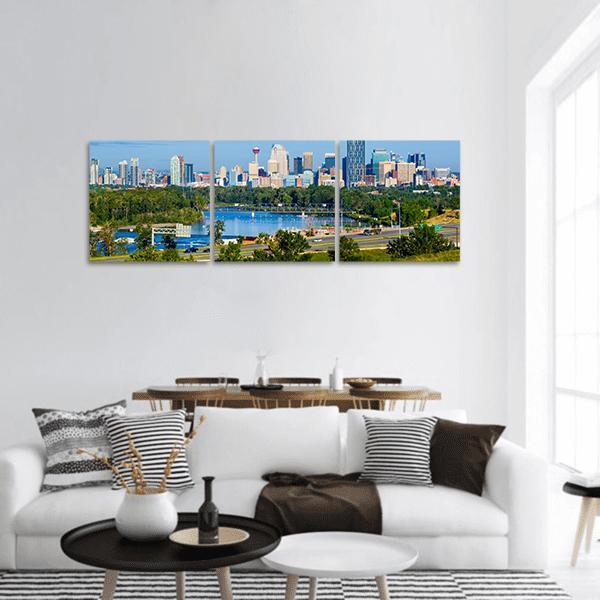 Calgary Skyline Over the Bow River Panoramic Canvas Wall Art in green and blue, hung on a wall