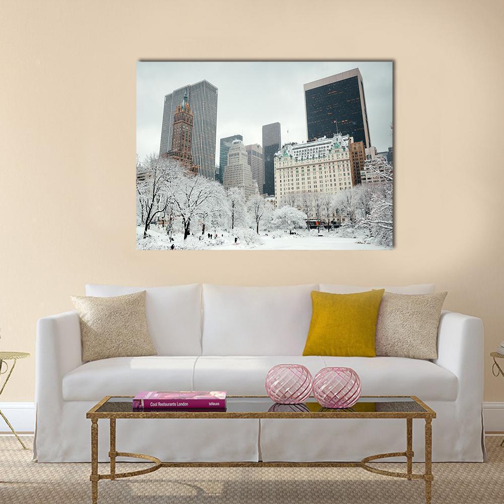 Snowy Manhattan Skyline in Winter Canvas Wall Art in white, gray and brown, single panel hung on a wall
