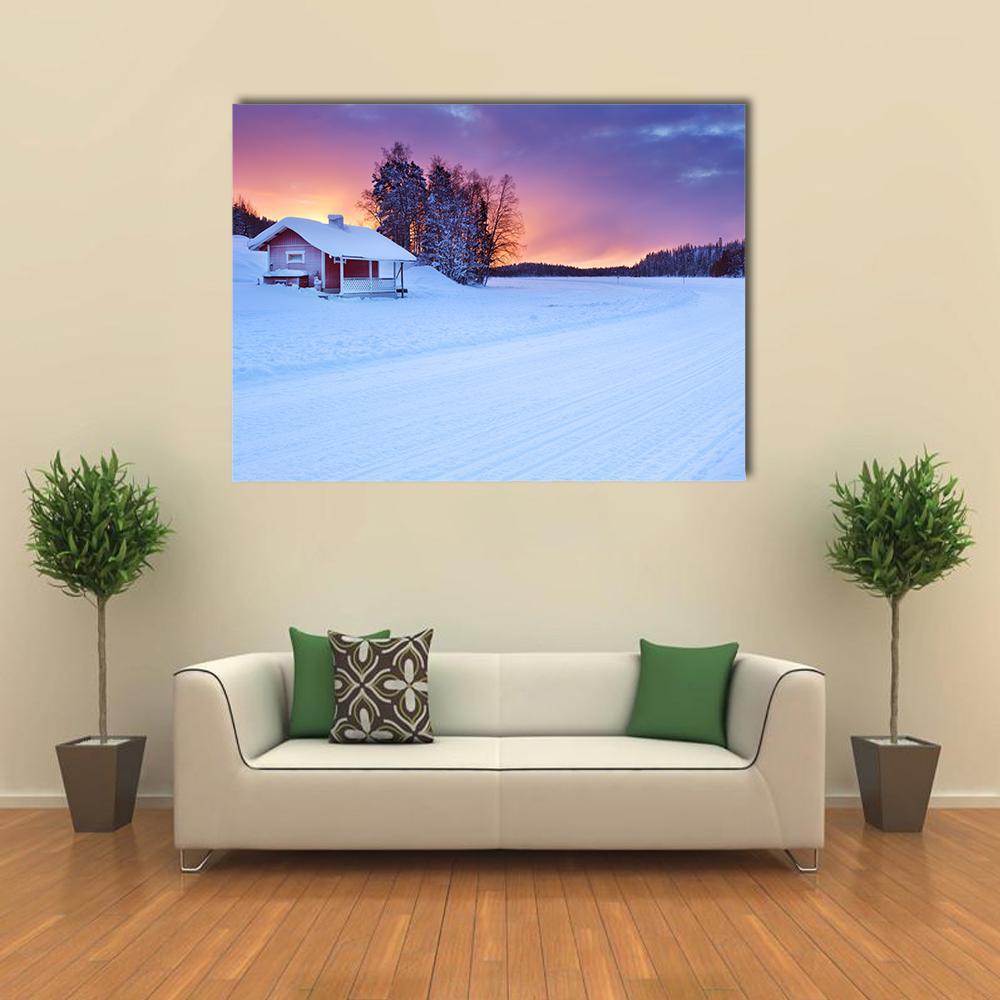 Red Cabin by Frozen Lake at Sunset Canvas Wall Art in white, orange and purple, single panel hung on a wall