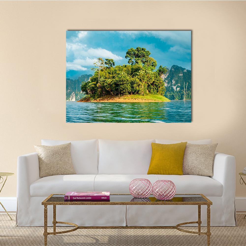 Small Island on Turquoise Lake Canvas Wall Art in green and blue, single panel hung on a wall