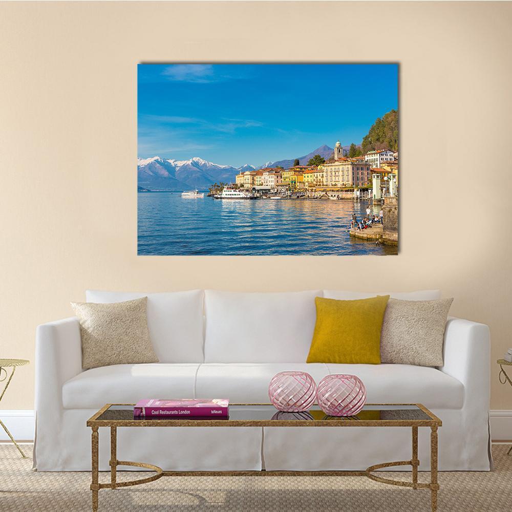 Small Village on Lake Como Canvas Wall Art in beige, yellow and blue, single panel hung on a wall