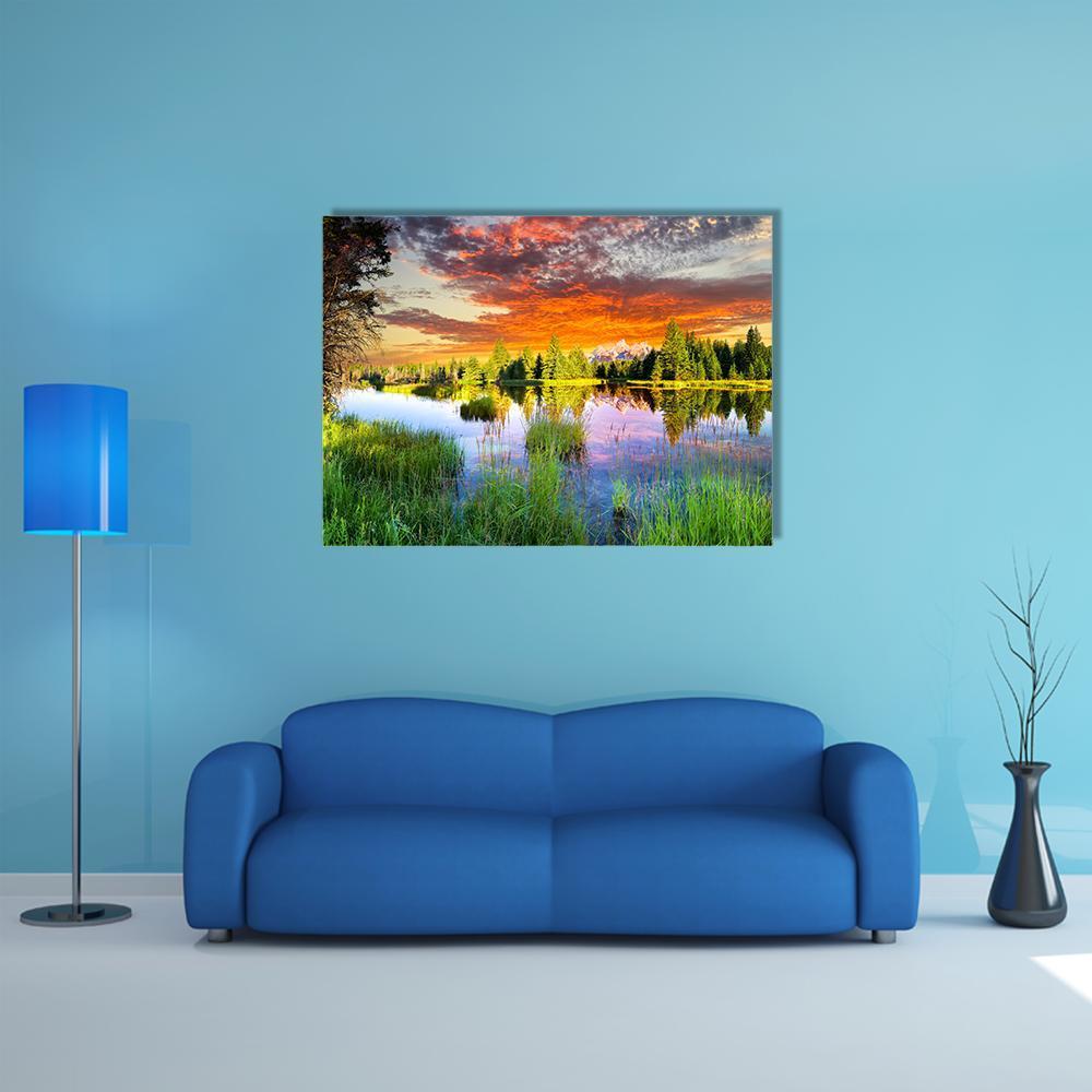 Snake River and Tetons at Sunset Canvas Wall Art in orange, green and blue, single panel hung on a wall