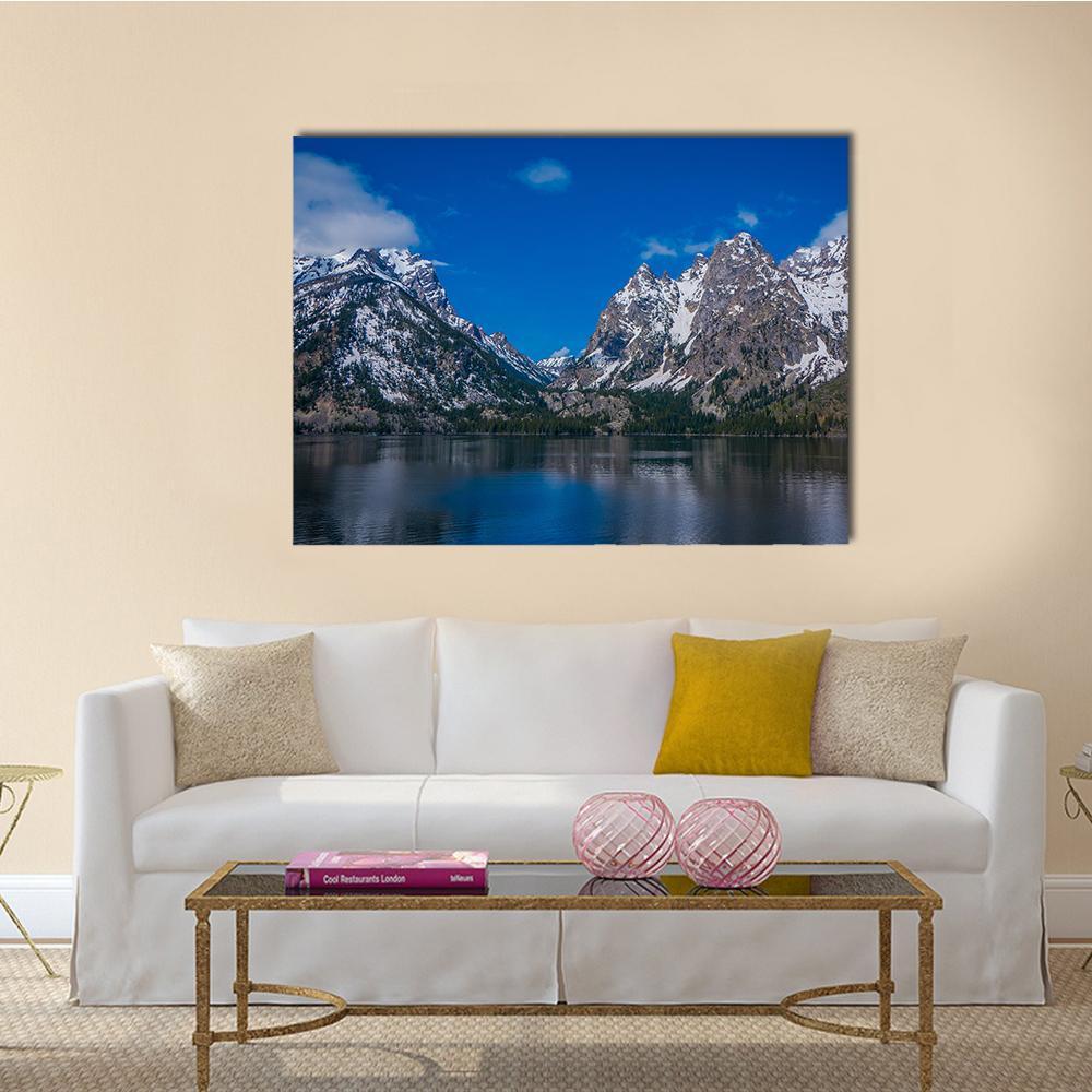 Snow-capped Mountain Reflection in Lake Canvas Wall Art in white, gray and blue, single panel hung on a wall