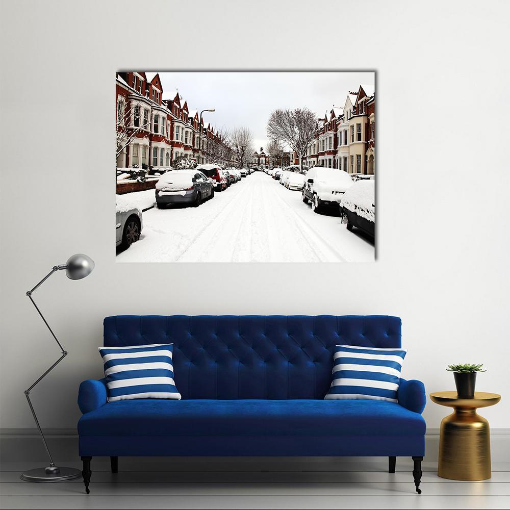 Snowy Street in London Canvas Wall Art in white, gray and red, single panel hung on a wall