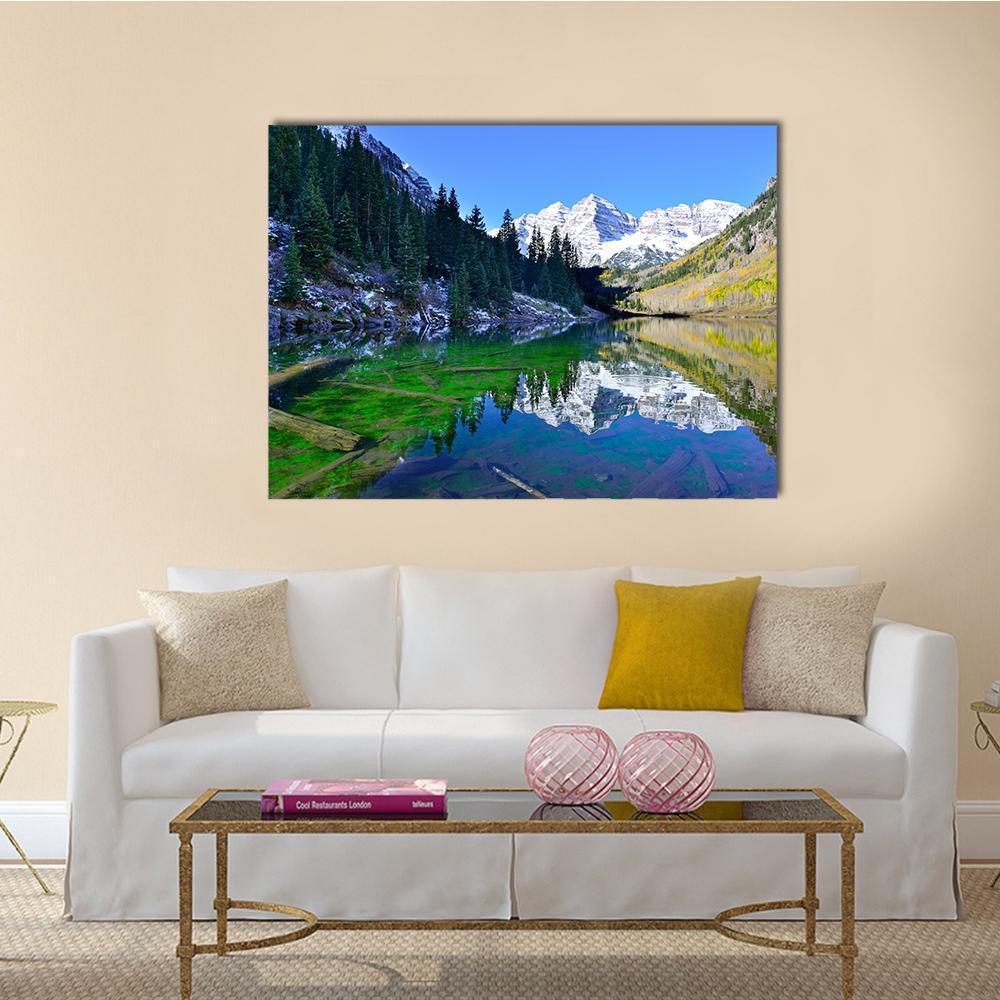 Snow-covered Mountains Reflected in Lake Canvas Wall Art in white, green and blue, single panel hung on a wall