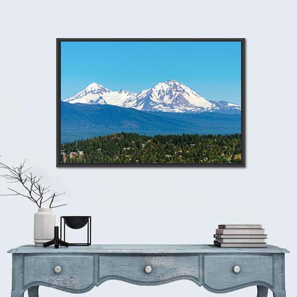 Snow Covered Three Sisters Mountains Canvas Wall Art in white, green and blue, framed canvas, product view on a white background