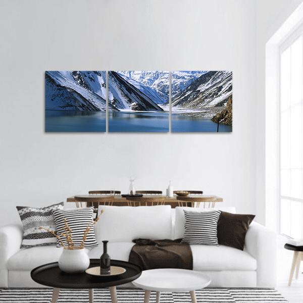 Snow-capped Mountain Lake Landscape Panoramic Canvas Wall Art in white, gray and blue, hung on a wall