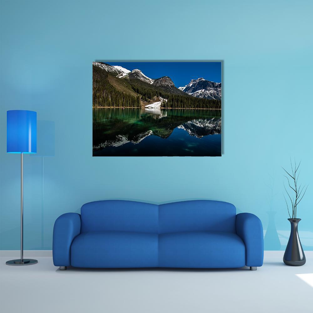 Snow on Emerald Lake Canvas Wall Art in white, green and blue, single panel hung on a wall