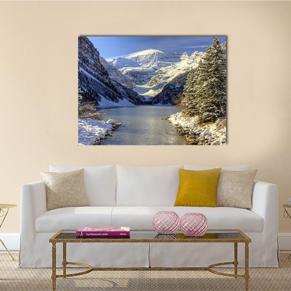 Snow on Lake Louise Canvas Wall Art in white, gray and blue, single panel hung on a wall