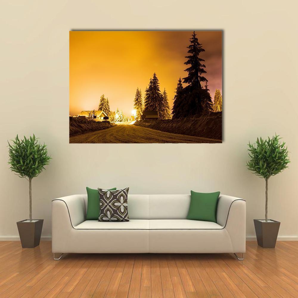 Snowy Road Under Street Lights Canvas Wall Art in black, orange and yellow, single panel hung on a wall