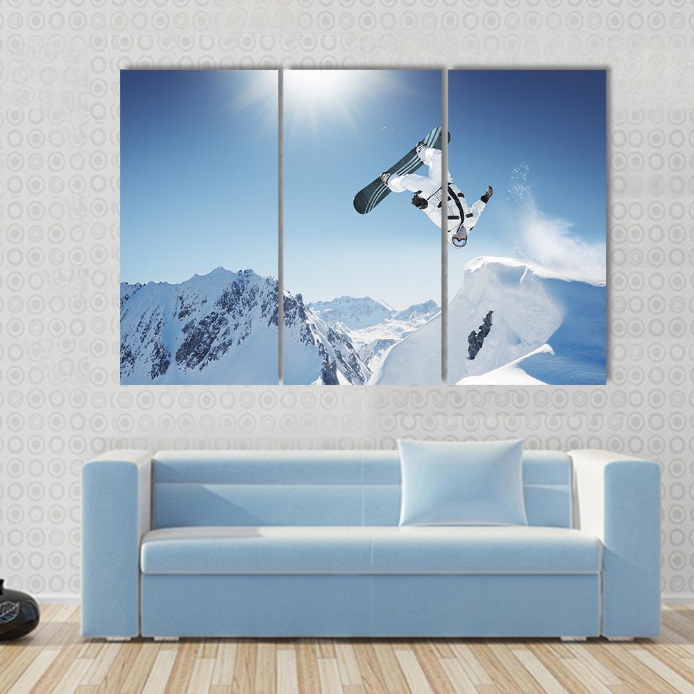 Snowboard Jump Canvas Wall Art in white and blue, 4 panel Pop layout hung on a wall