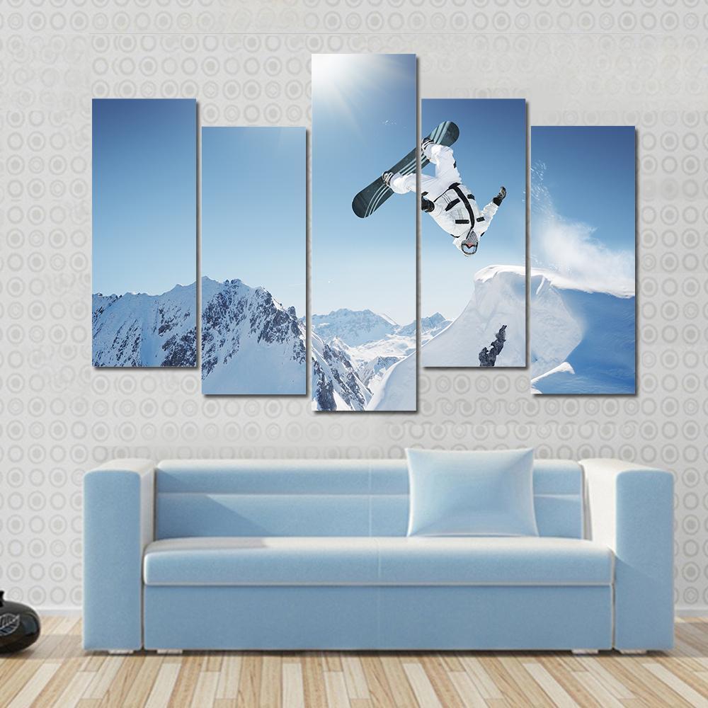 Snowboard Jump Canvas Wall Art in white and blue, 4 panel Pop layout hung on a wall