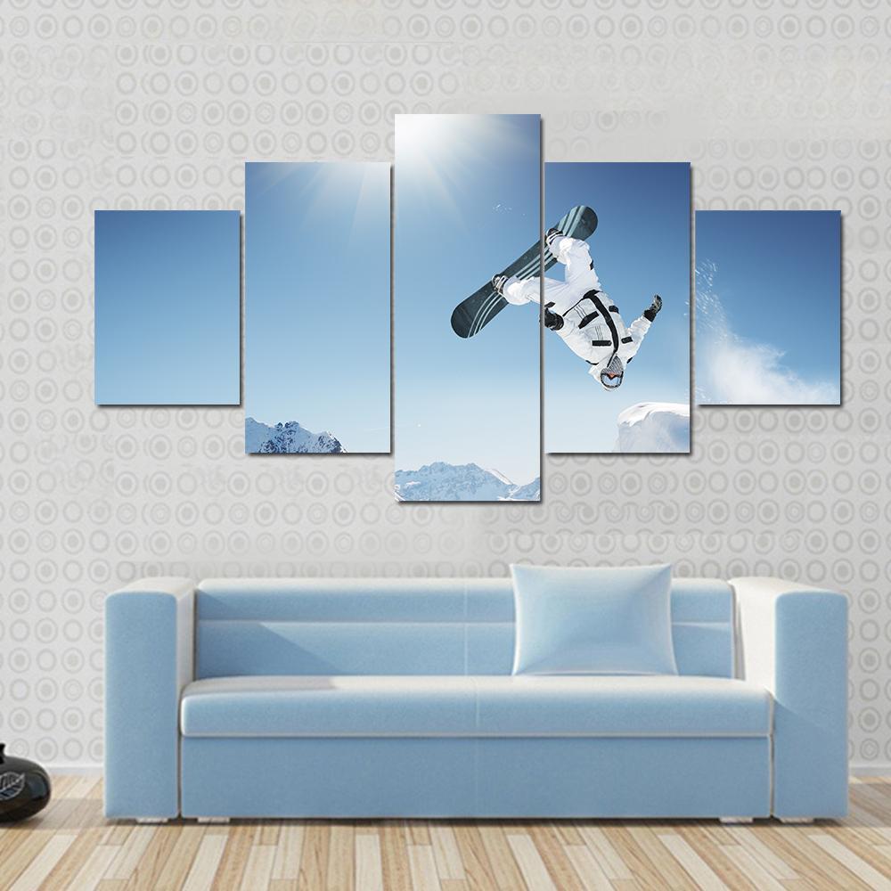 Snowboard Jump Canvas Wall Art in white and blue, 4 panel Pop layout hung on a wall