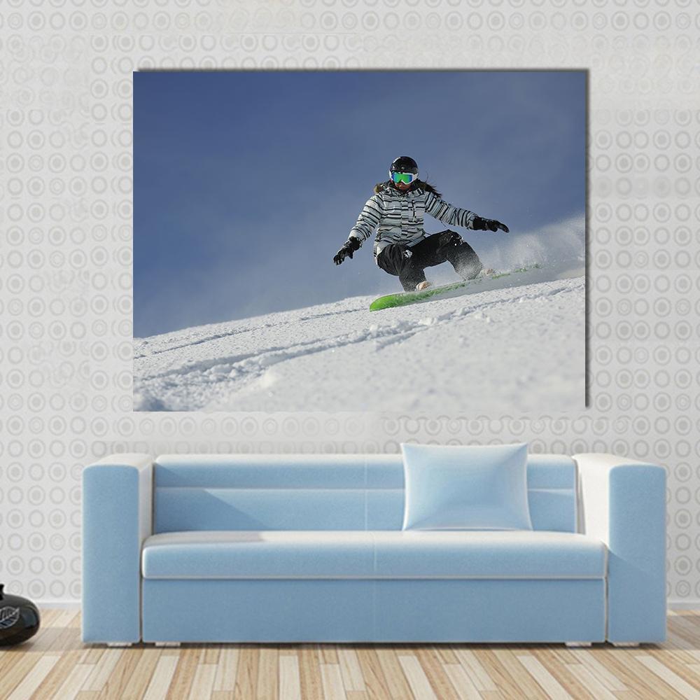 Snowboard Woman Racing Downhill Slope Canvas Wall Art in white and blue, single panel hung on a wall