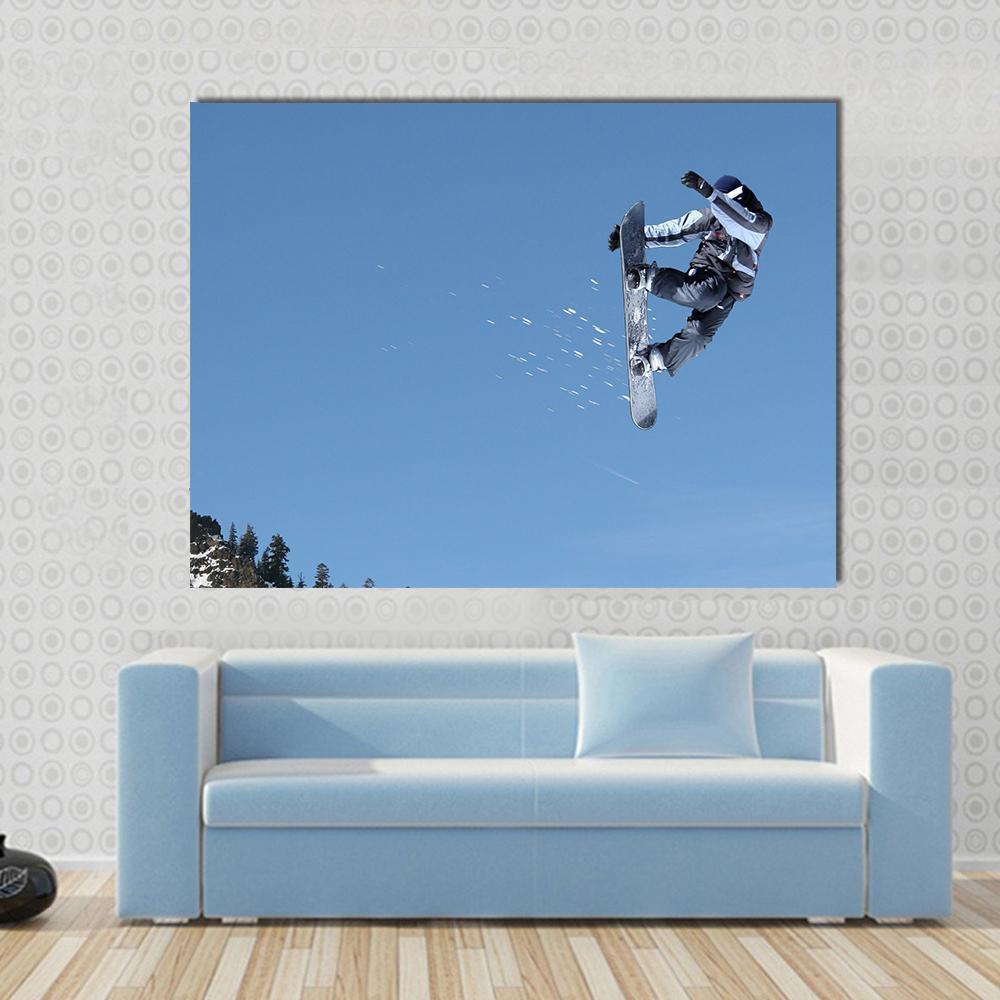 Snowboarder Jumping High at Lake Tahoe Canvas Wall Art in white and blue, single panel hung on a wall