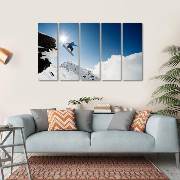Snowboarder Jumping Through Air After Rock Drop Canvas Wall Art-5 Horizontal-Gallery Wrap-22" x 12"-Tiaracle